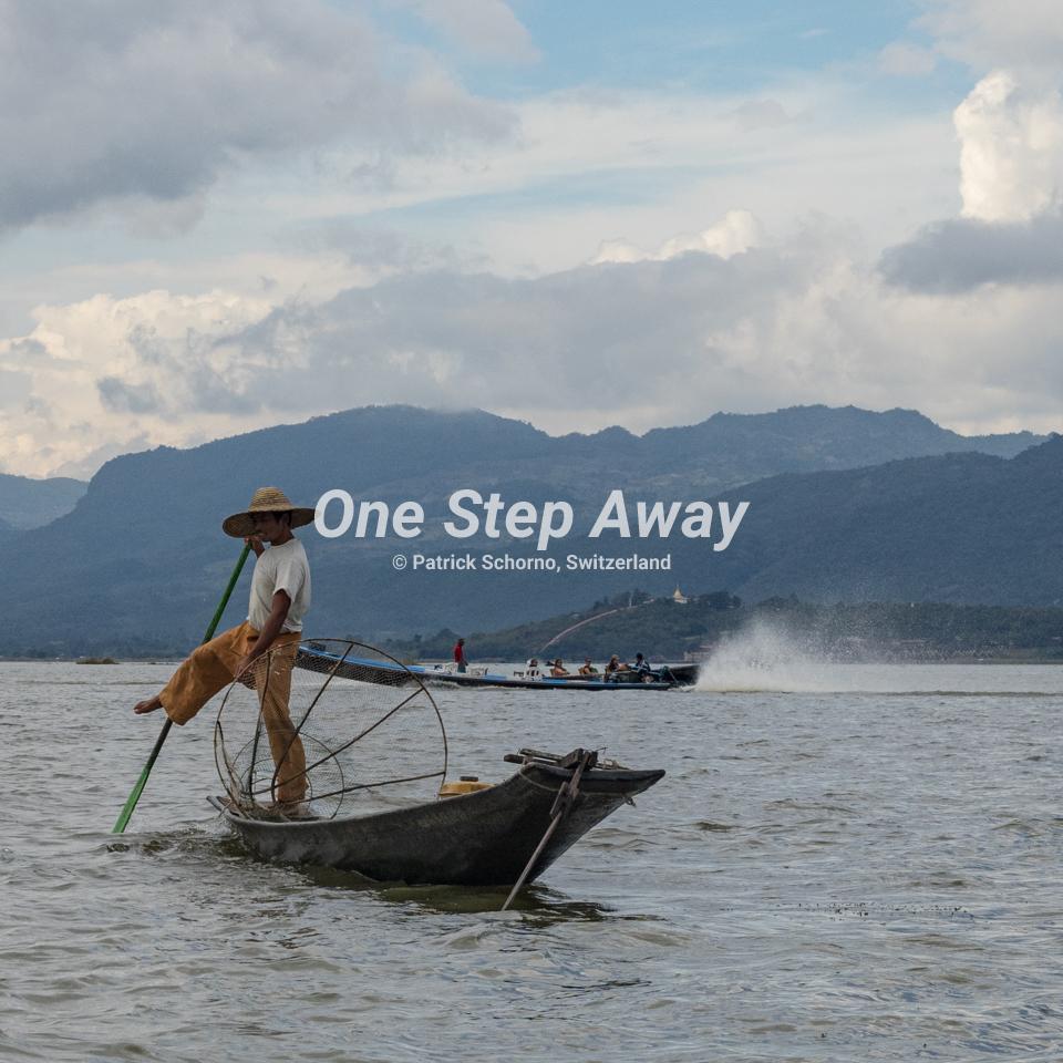 Myanmar - Inle Lake / traditional fisherman staying on boat with net, traditioneller Fischer auf Boot mit Netz